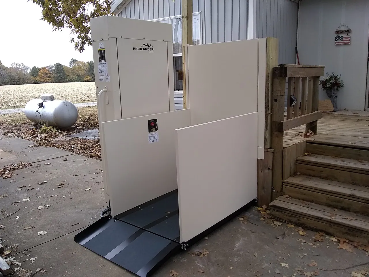 Wheelchair platform lift installed against a raised deck