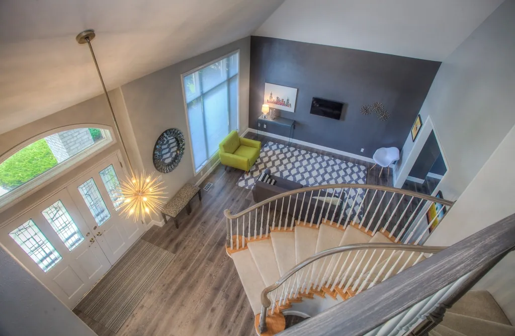 Two-storey home foyer with a curved staircase