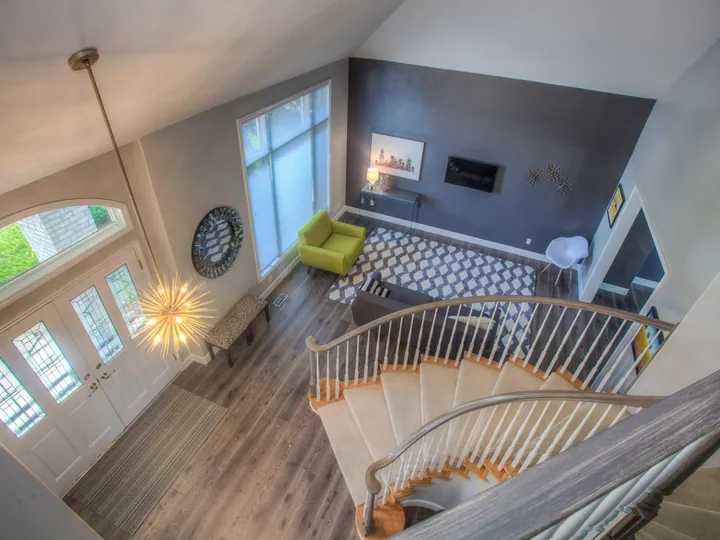 Two-storey home foyer with a curved staircase